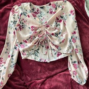 Color-Pink with floral design. Size Small